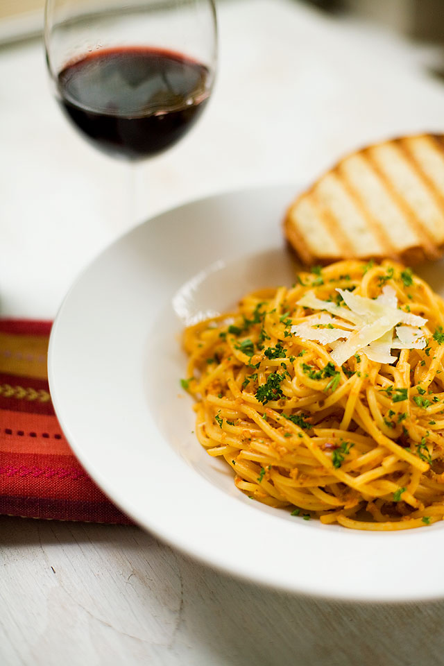 Pasta in creamy tomato sauce with pumpkin seeds
