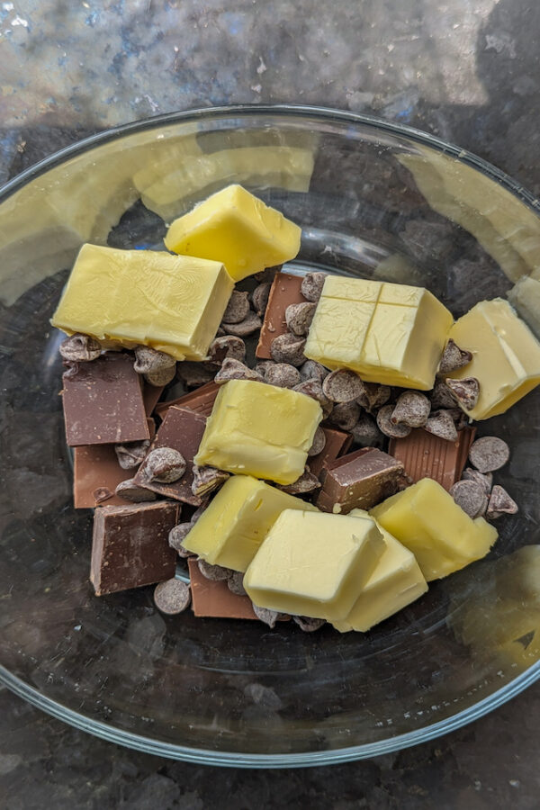 Melt chocolate and butter in double boiler